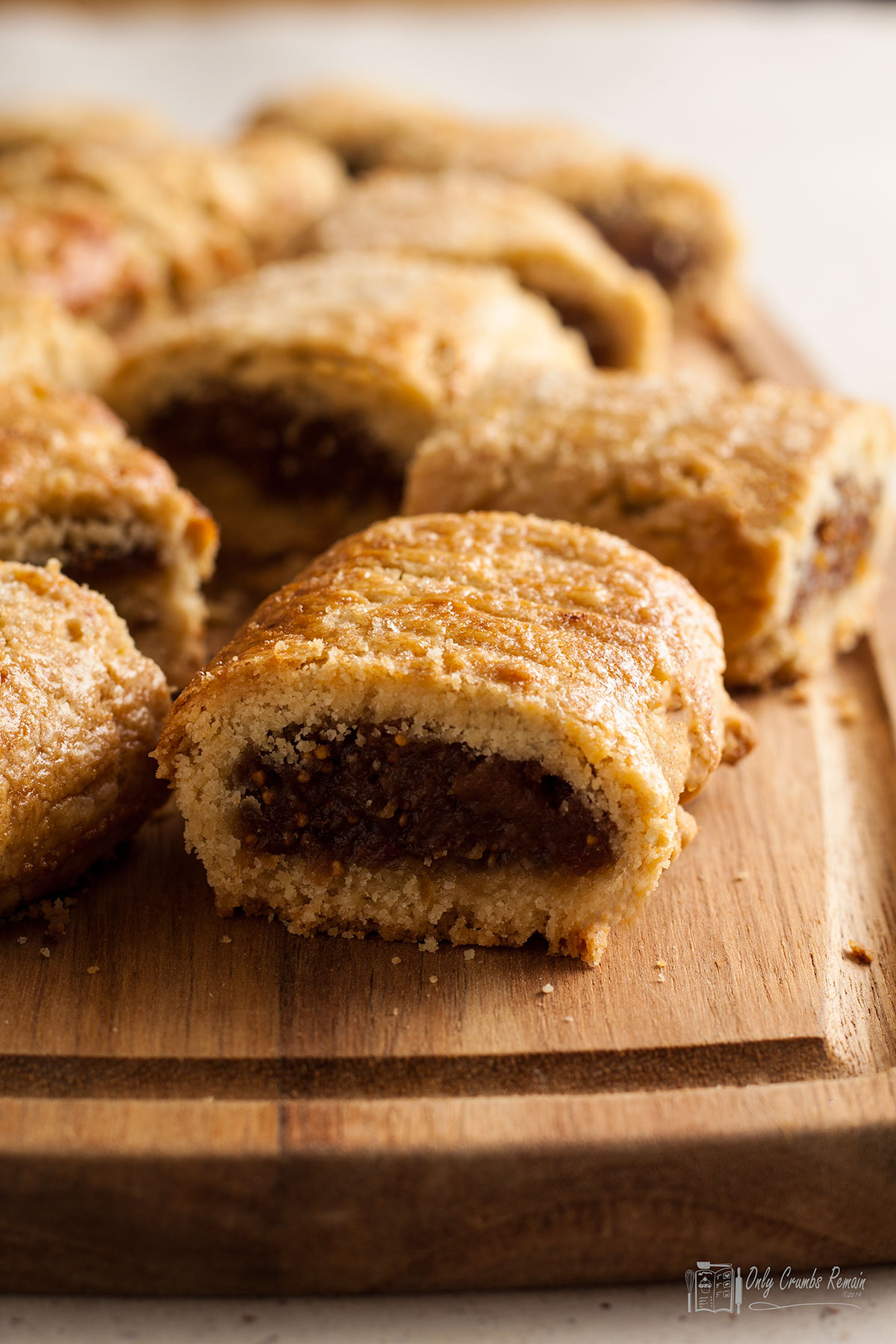 closeup of homemade fig rolls on a board.