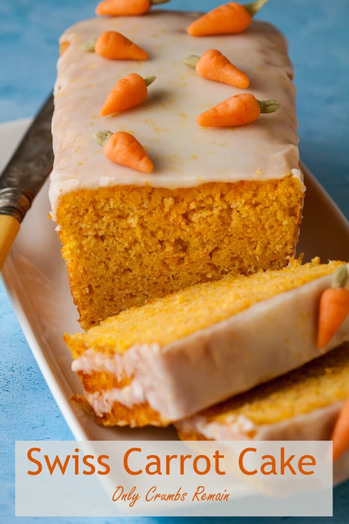 sliced swiss carrot loaf cake decorated with marzipan carrots .