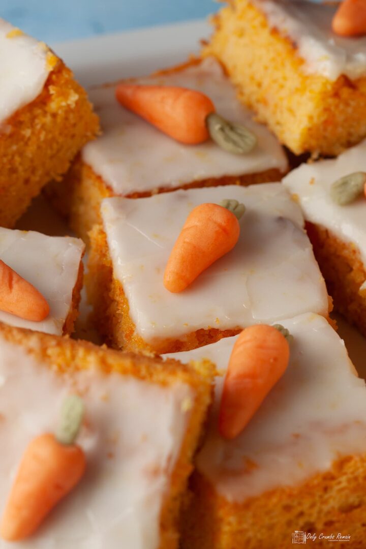 swiss carrot cake baked in square tin and cut into squares to serve.