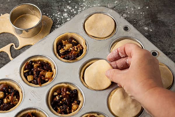 placing pastry lids.