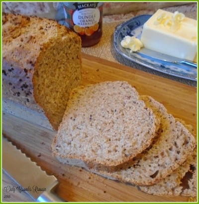spelt and quinoa loaf sliced on bread board