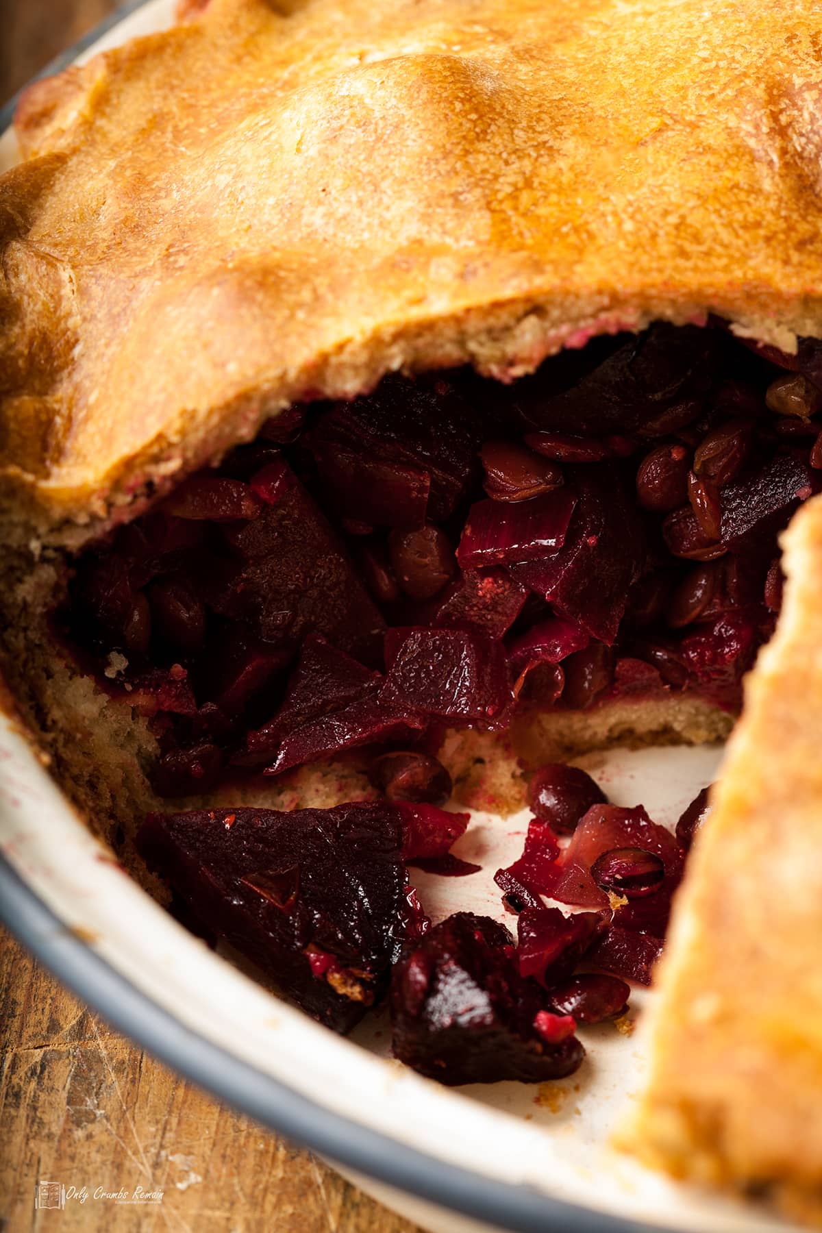 whole beetroot pie with slice out