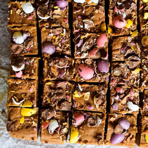 squares of easter chocolate fudge topped with crushed mini eggs.