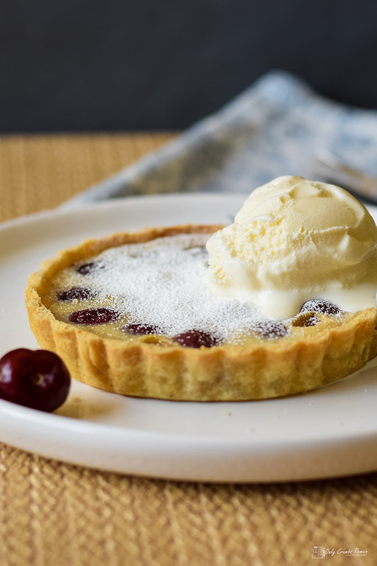 Cherry clafoutis served with ice cream on top