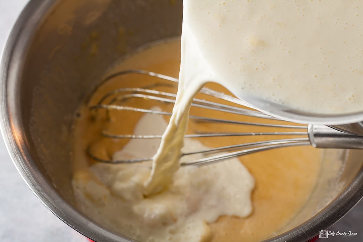 whisking in the hot milk.