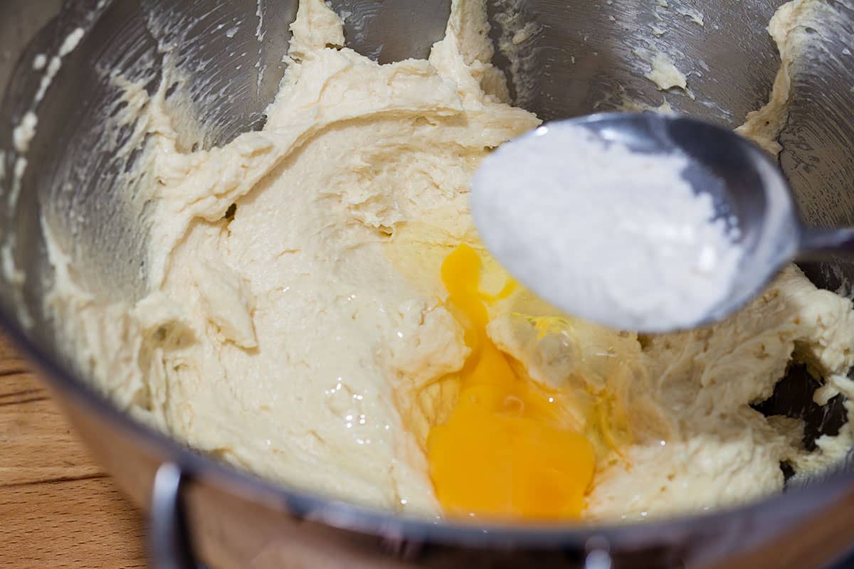 adding flour with last egg.