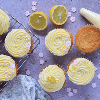 lemon and elderflower cupcakes on a rack