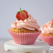 strawberry cupcake on a mini cake stand.