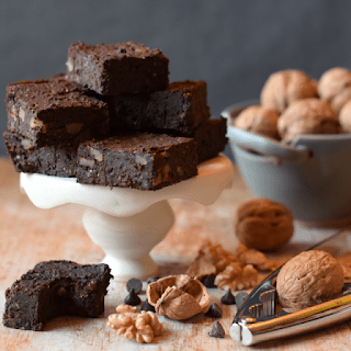vegan black bean brownies stacked on mini cake stand