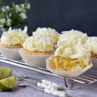 coconut and lime cupcakes on a cooling rack