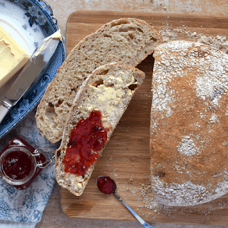 no knead bread sliced and spread with jam