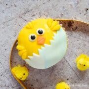 Easter chick cupcake with ribbon and mini chick cake decoaretions
