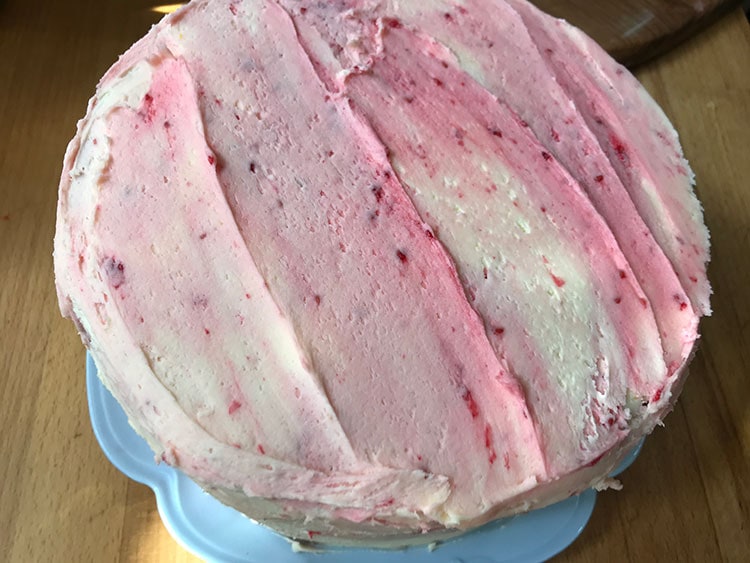 buttercream smoothed on cake