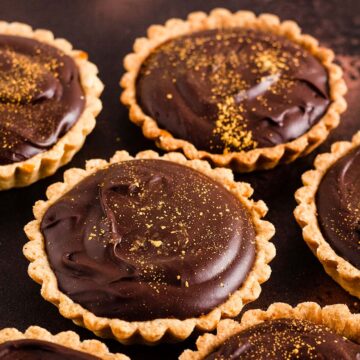 chocolate and salted caramel tarts sprinkled with edible glitter dust.
