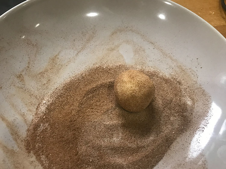 ball of cookie dough coated in sugar