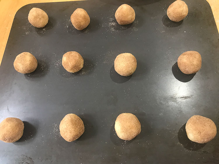 uncooked cookies on a baking sheet