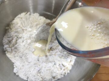 adding egg mixture to dry ingredients.