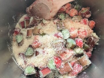 mixed sugar and fruit in a pan.