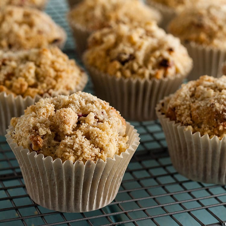 Gooseberry crumble muffins on a cooling rack