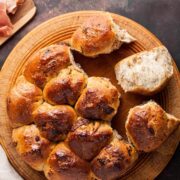 fig and rosemary tear and share bread on a round board