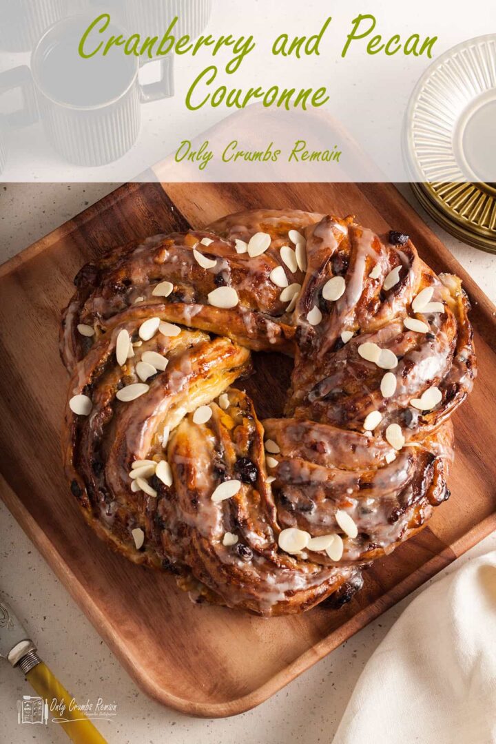 cranberry and pecan couronne on a wooden board