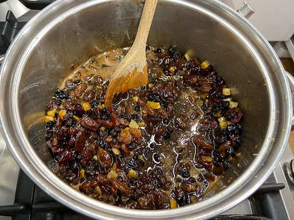 fruit mixture simmering in pan.