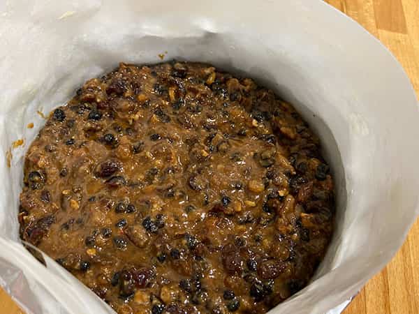 uncooked cake mixture in the tin.