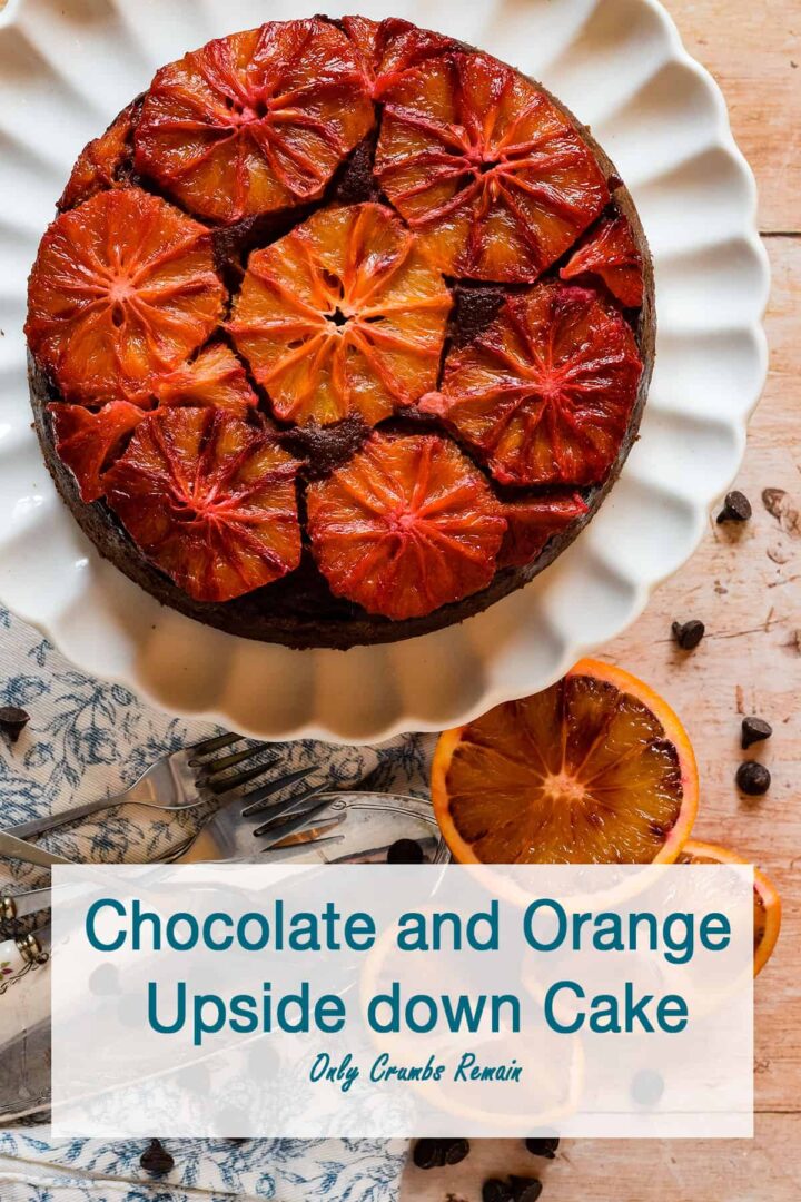 chocolate orange upside down cake on a cake stand.