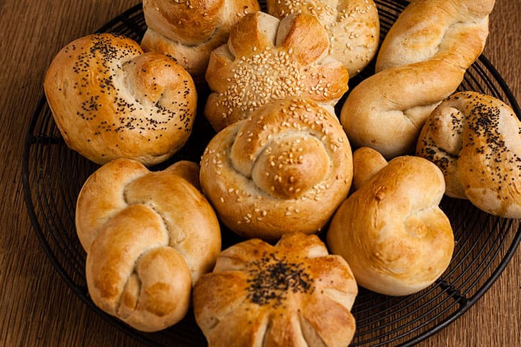 selection of rolls on a wire rack.