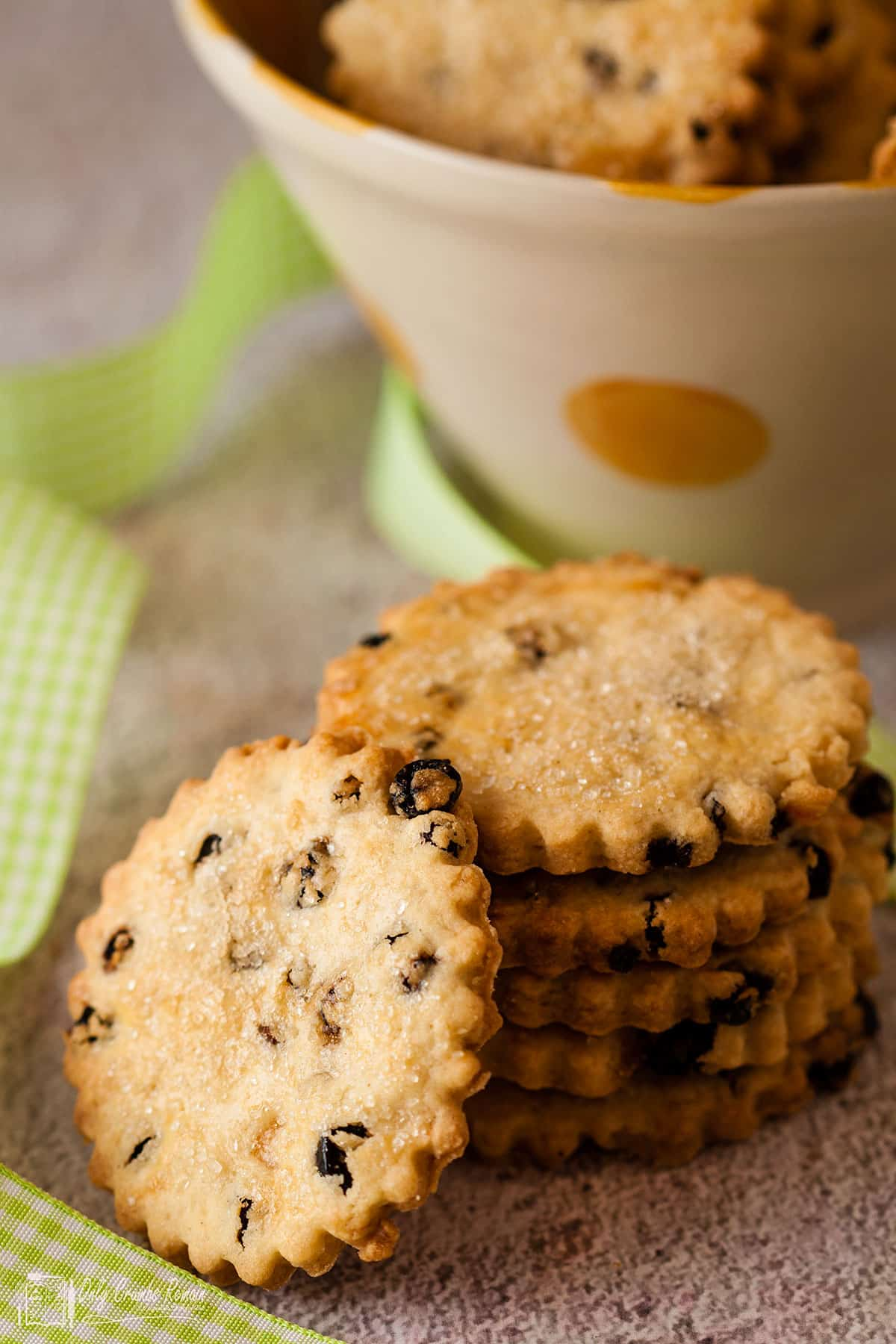 bowl of biscuits with stack in front.