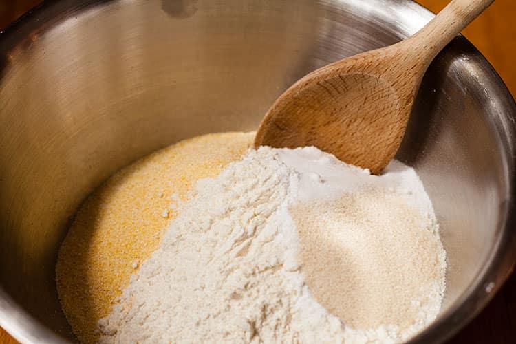 cornmeal, flour, sugar and salt in bowl.