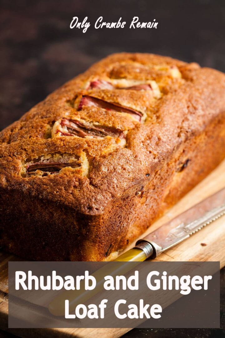 rhubarb and ginger loaf cake on a wooden board with knife.