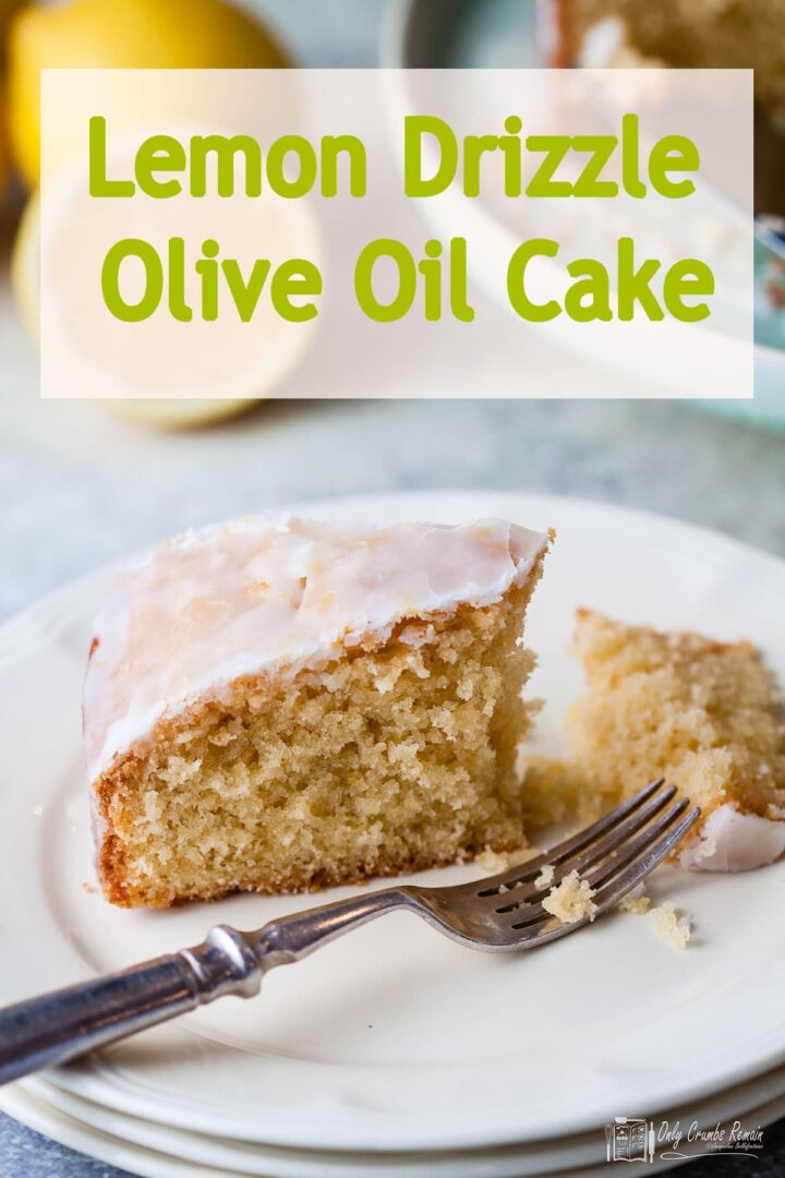 portion of lemon drizzle olive oil cake broken with fork with text overlay.