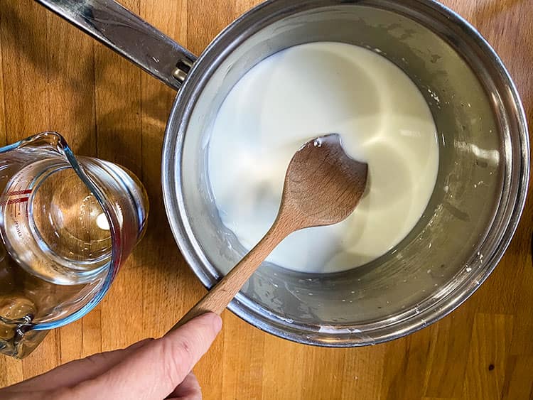 combining cornflour and water in pan.