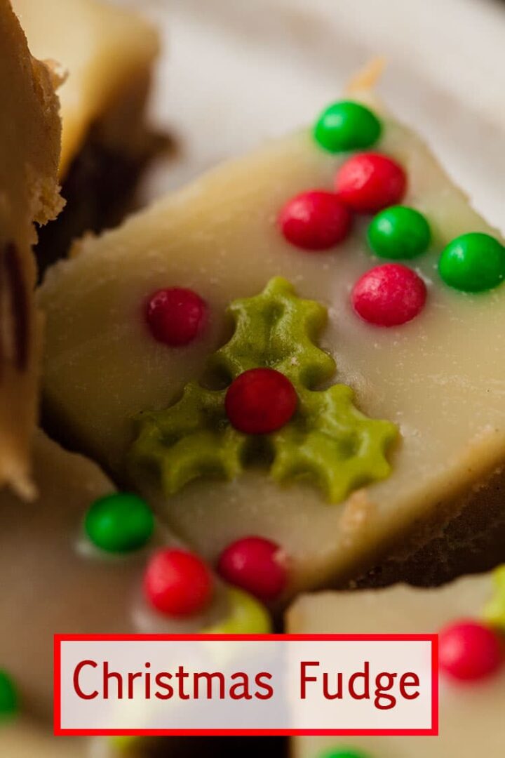 close up of a piece of fudge decorated with tiny holly sugar sprinkle.