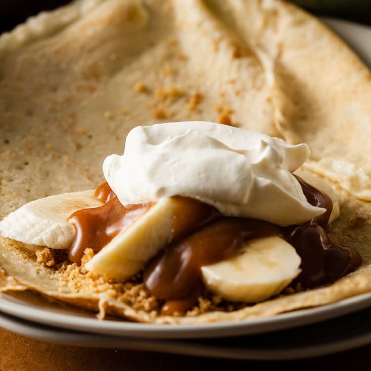 Filling topped with a spoon of cream.