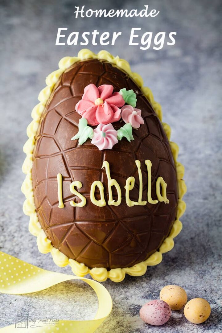iced Easter egg decoarted with persons name and sugar flowers.