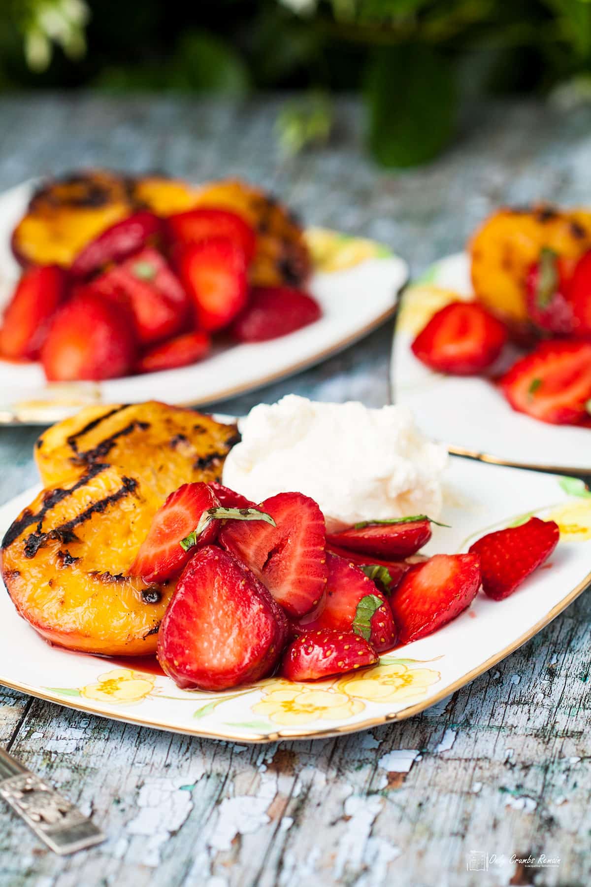 three plates of griddled peaches with macerated strawberries