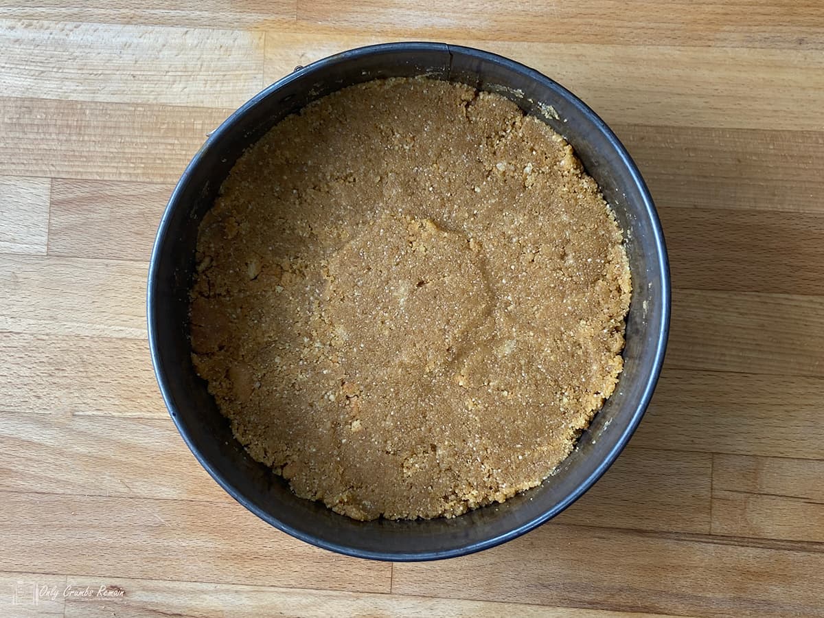 biscuit base in cake tin.