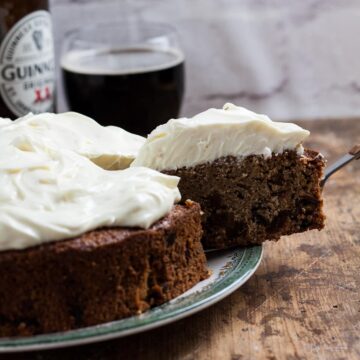Guinness cake with a slice being removed/