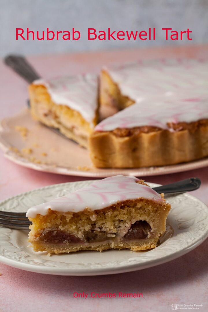 Slice of Rhubarb Bakewell Tart on a plate. Cut tart on serving plate behind.